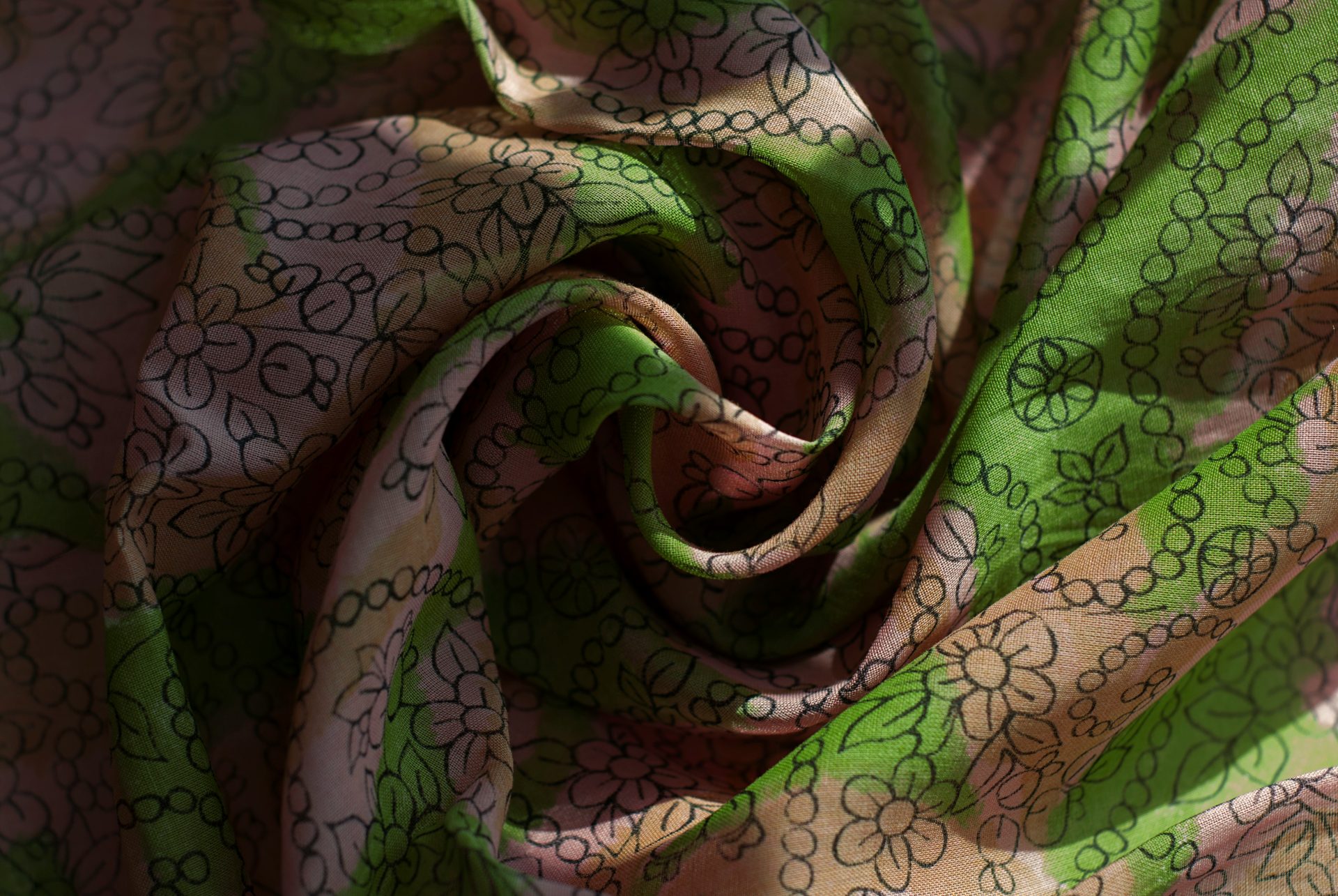 A close up of a green and brown fabric
